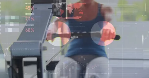 Animation of financial data processing over caucasian woman exercising at gym Stock Footage 307815728