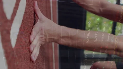Animation of financial data processing over exercising caucasian man Stock Footage 312422246