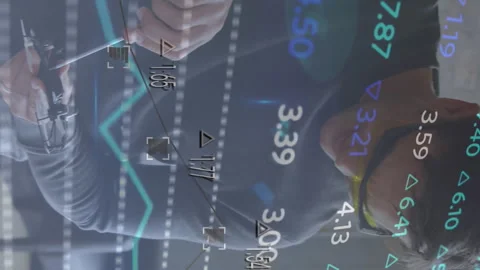 Animation of financial data processing over man and apprentice working in Video stock 312509511