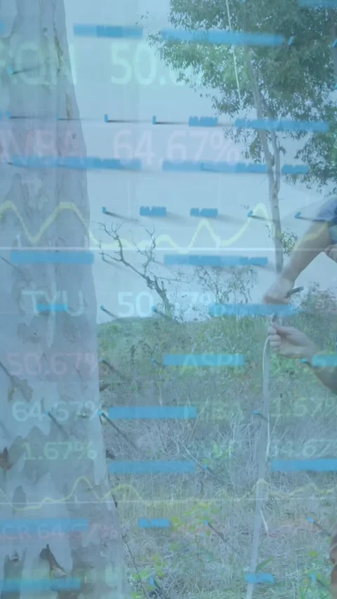 Animation of financial data processing over caucasian workers cutting tree Stock Footage 319222193