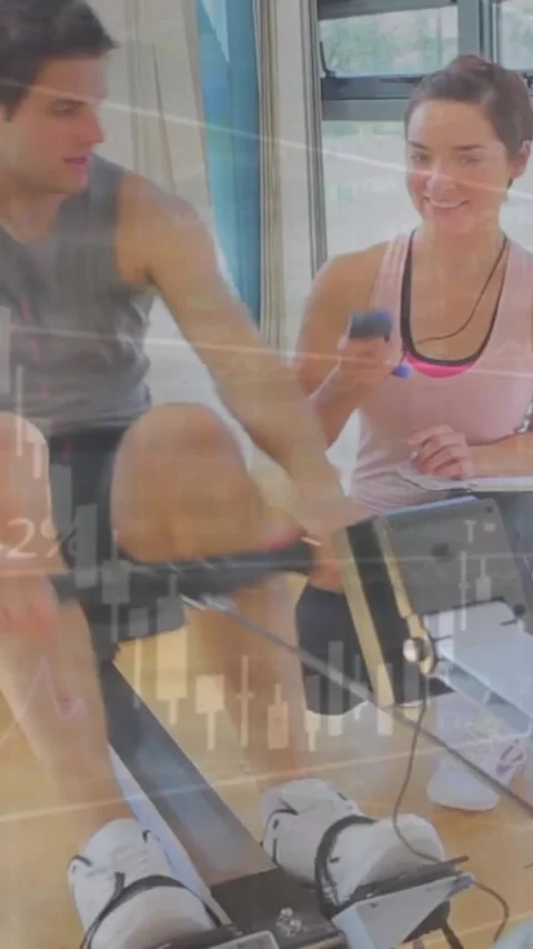 Animation of financial data processing over caucasian man exercising with female Stock Footage 323488534