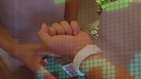 Animation of financial data processing over caucasian woman paying with watch at Stock Footage 327002595