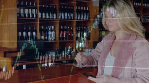 Animation of financial data processing over caucasian woman testing wine using Stock Footage 327356607