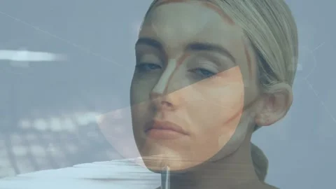 Animation of financial data processing over women doing makeup Stock Footage 327847203