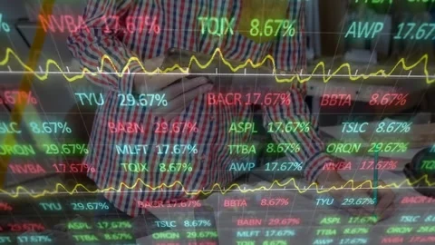 Animation of financial data processing over man using computer Stock Footage 328461287