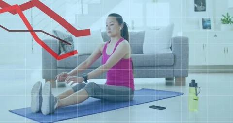 Animation of financial data processing over asian woman exercising on mat at 動画素材 328978370