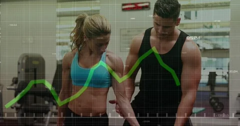 Animation of financial data processing over caucasian man and woman exercising 動画素材 329365096