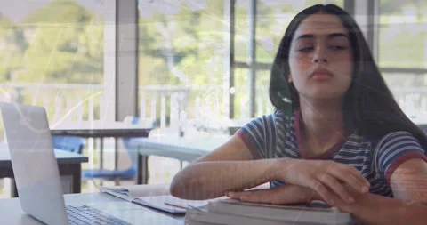 Animation of financial data processing over schoolgirl sleeping by laptop in Stock Footage 329922892