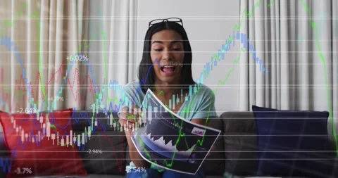 Animation of financial data processing over businesswoman holding sheet with Stock Footage 330103343