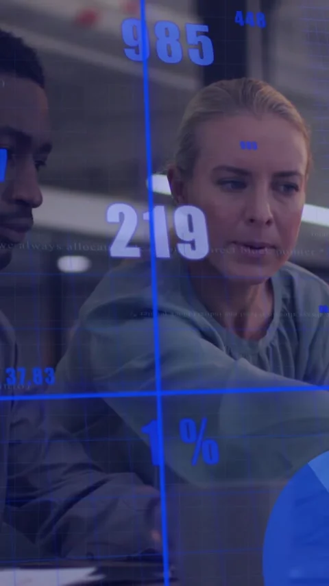 Animation of financial data processing over diverse colleagues using laptop in Stock Footage 343128853