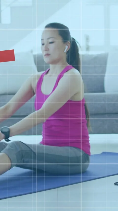 Animation of financial data processing over asian woman exercising on mat at Stock Footage 343887424