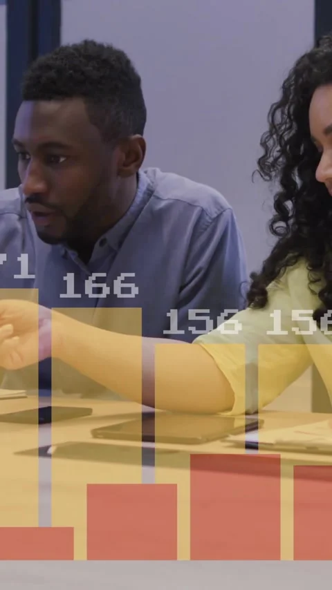 Animation of financial data processing over diverse colleagues discussing work Stock Footage 343888338