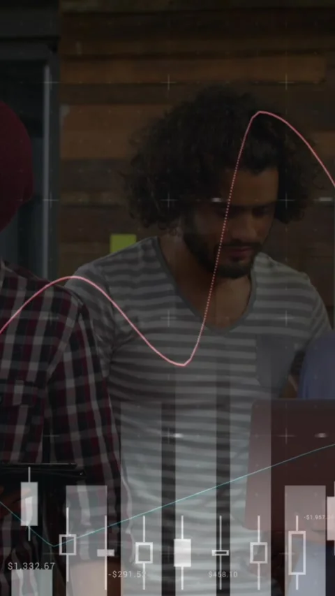 Animation of financial data processing over diverse business people using laptop Stock Footage 343919250