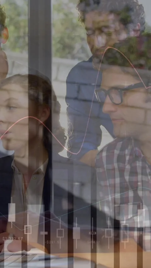 Animation of financial data processing over diverse business people using laptop Stock Footage 343954534