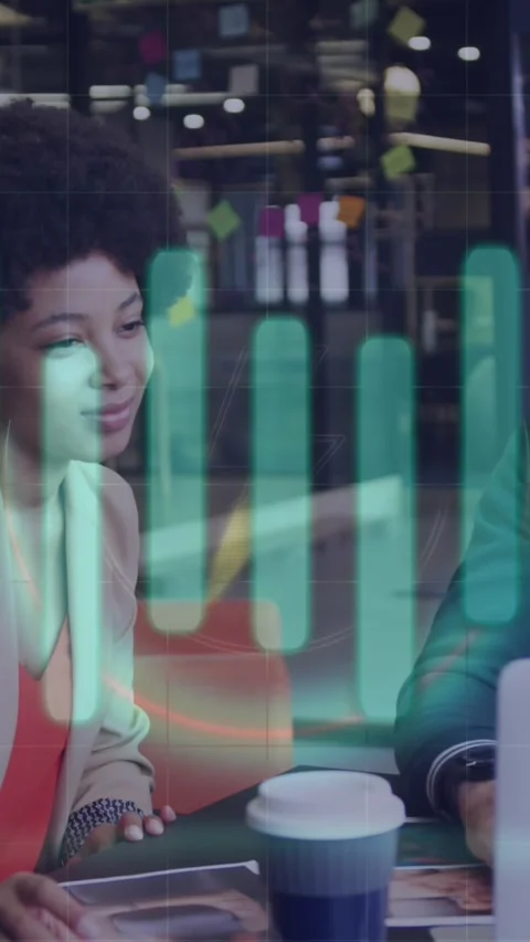 Animation of financial data processing over diverse business people using laptop Stock Footage 344011914