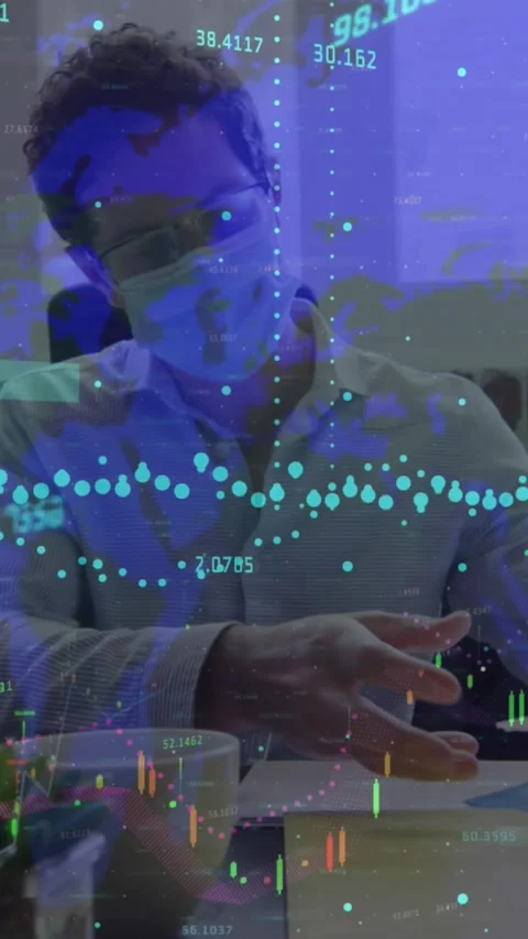 Animation of financial data processing over businessman in face mask in office Stock Footage 344765762