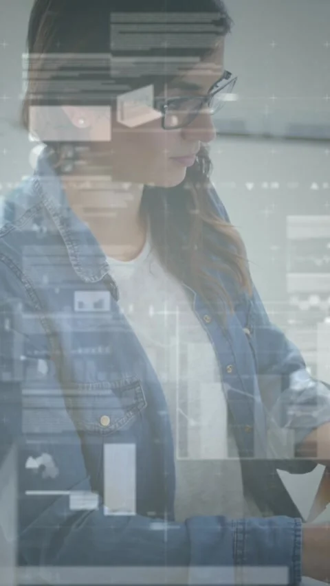 Animation of financial data processing over businesswomen using laptop Stock Footage 344783043