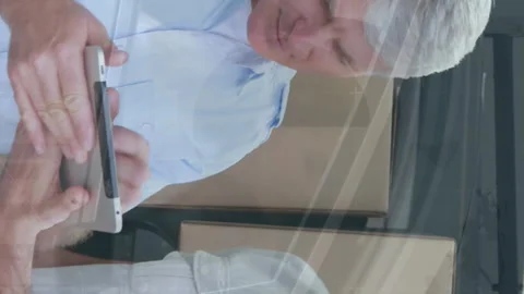 Animation of financial graphs over happy caucasian male courier delivering Video stock 312422133