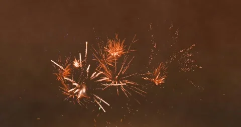 Animation of fireworks exploding on brown background Stock Footage 328408479