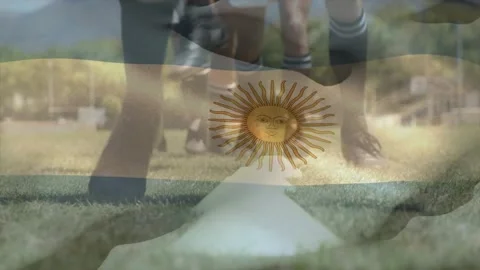 Animation of flag of argentina over diverse rugby players practicing on field Stock Footage 329706064