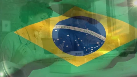 Animation of flag of brasil over diverse female and male architect studying Stock Footage 329920551