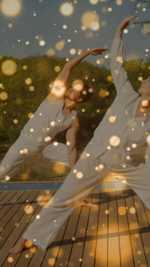 Animation of floating light spots over caucasian couple practicing yoga Stock Footage 320280390