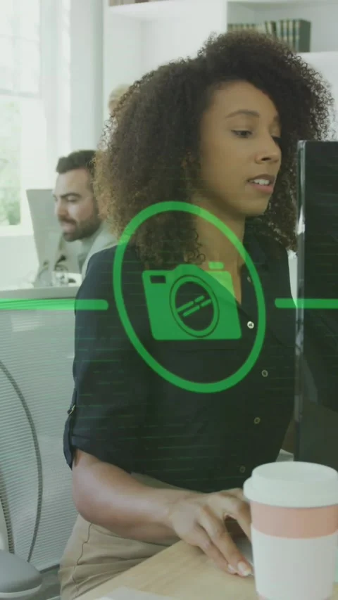 Animation of flowchart of icons over african american woman working on desktop Stock Footage 344766100