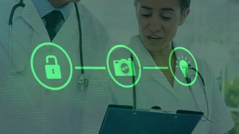 Animation of flowchart of icons over diverse doctors over discussing patients Stock Footage 330254955