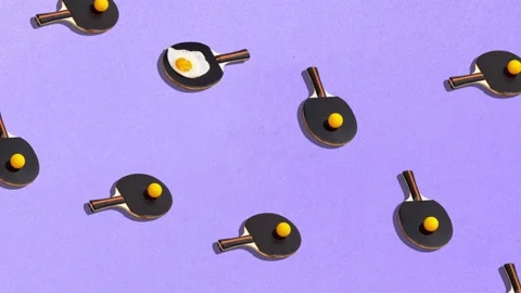 Animation. Food pattern with fried egg on table tennis racket on purple Stock Footage 262556533