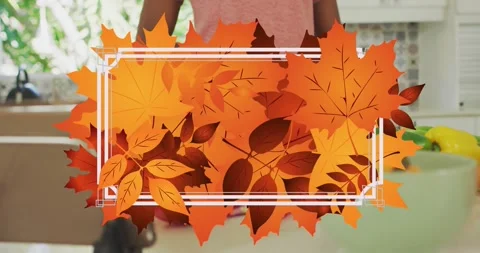Animation of frame with fall leaves over african american woman cutting Stock Footage 330725317