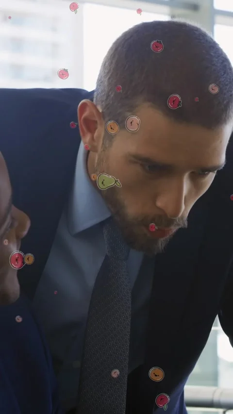 Animation of fruit icons over diverse businessmen talking Stock Footage 323151843