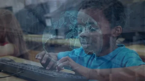 Animation of globe over happy african american boy using computer Stock Footage 329692041