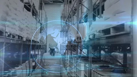 Animation of globe rotating over back view of caucasian female warehouse worker Stock Footage 325962342