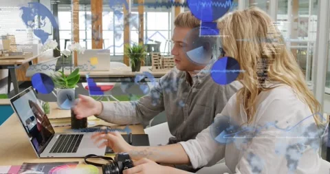 Animation of globes and computer language over caucasian coworkers discussing Stock Footage 328145780