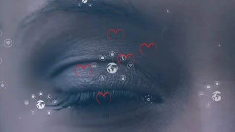 Animation of globes and hearts floating over eye of caucasian woman in make up Stock Footage 316461349