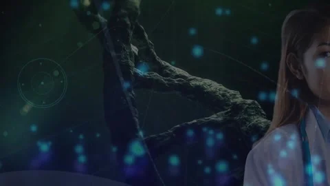 Animation of glowing blue spots falling over asian female doctor against Stock Footage 329775099