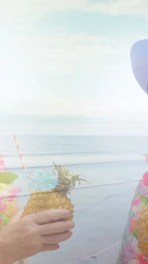 Animation of glowing light over happy senior couple having cocktails by seaside Vídeo Stock 342097446