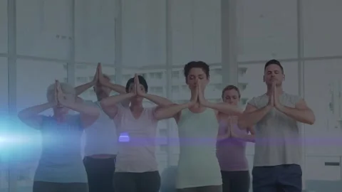 Animation of glowing light over people practicing yoga Stock Footage 156961824