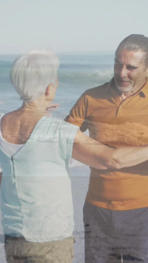 Animation of glowing light over portrait of happy senior couple dancing by Vídeo Stock 342097444