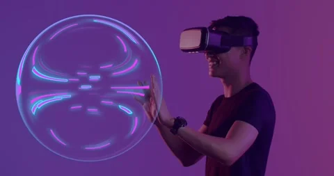 Animation of glowing light trails of data transfer and asian man in vr headset Stock Footage 241343761
