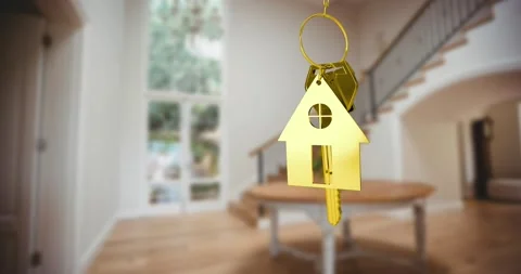 Animation of gold key and key ring over blurred house interior Stock Footage
