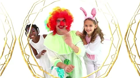 Animation of gold pattern over diverse happy children and clown having fun at Stock Footage 156571229