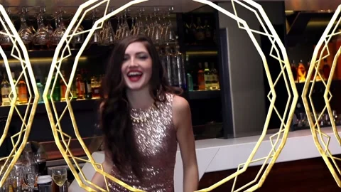 Animation of gold pattern over happy woman dancing having fun at party Stock Footage 157349497