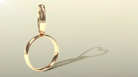 Animation of Golden Wedding Ring with shadows in heart shape Stock Footage 32887830
