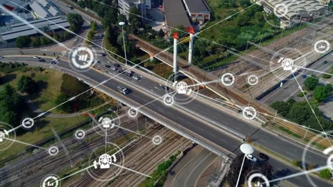 Animation of graph and profile connected icons over aerial view of vehicles Stock Footage 326186822