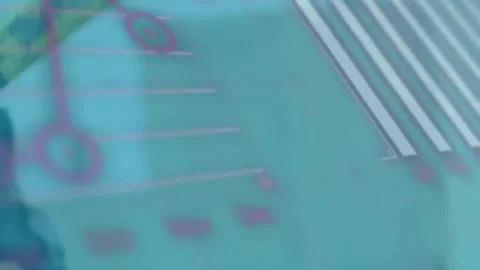 Animation of graph, globe and computer language over caucasian man hitting nail Stockbeeldmateriaal 257088236