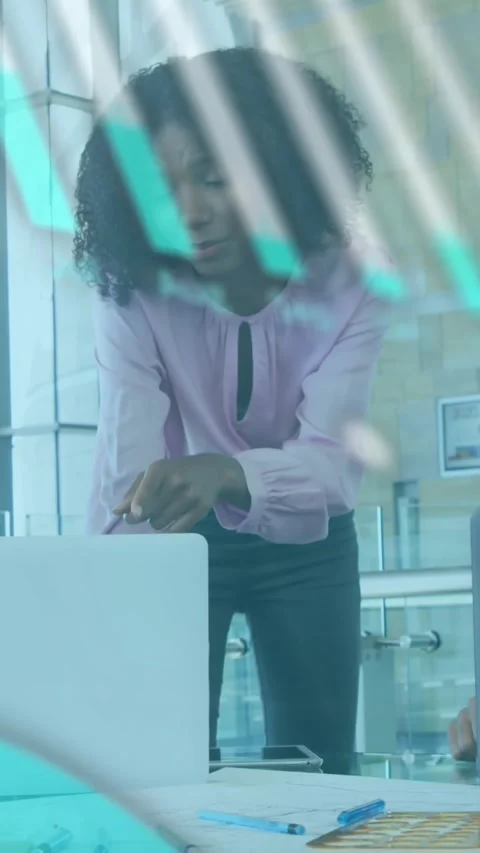Animation of graph, globe and computer language over diverse coworkers Stock Footage 320921710