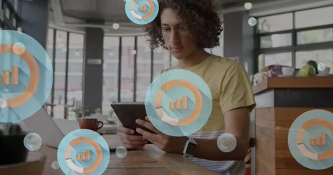 Animation of graph icon in circles over man scrolling on digital tablet in cafes Stock Footage 329418276