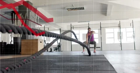 Animation of graph processing data over caucasian woman cross training with Stock Footage 329103215