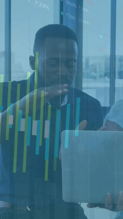 Animation of graph processing data over two diverse colleagues with laptop Stock Footage 344706662
